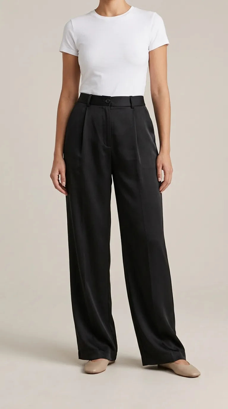 Black high-rise pleated wide-leg trousers worn by a model, front view